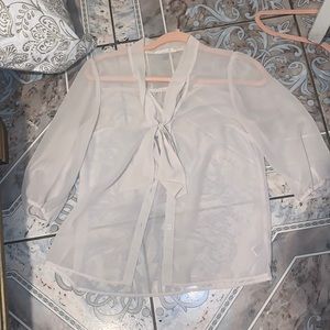 white shirt and can be worn with a white tank top